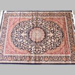 A Keshan rug, on a blue ground,