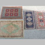 A modern Turkish woollen rug, with hooked central medallions, 86 x 156cm,