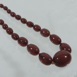 A cherry amber graduated bead necklace,