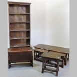 A 1920's oak standing open bookcase, 72cm, together with a 1920's oak folding bed,