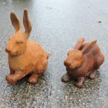 A rusted iron garden model of a rabbit, 36cm tall,