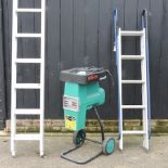 A folding ladder, together with a garden shredder and a long ladder,