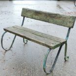 A green painted cast iron and wood garden bench,