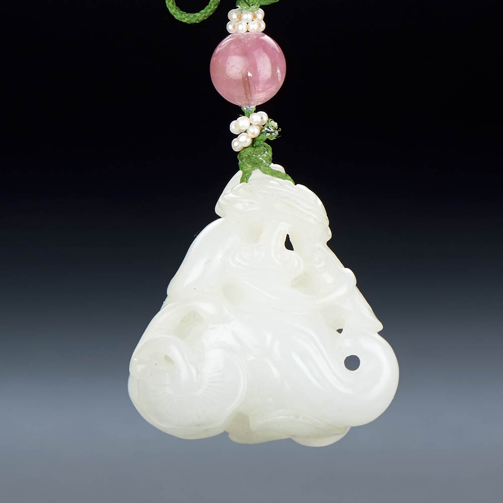 A CHINESE WHITE JADE 'BAT AND WATER CALTROPS' PENDANT - Image 2 of 2