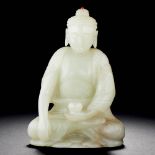 A CHINESE WHITE JADE FIGURINE OF SEATED BUDDHA