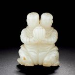 A CHINESE WHITE JADE CARVING OF TWO BOYS