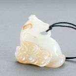 A CHINESE WHITE AND RUSSET JADE MYTHICAL DEER