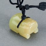 A CHINESE YELLOW JADE TIGER PENDANT