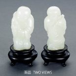 A CHINESE WHITE JADE CARVING OF 'BOY HOLDING LOTUS'