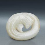 A CHINESE WHITE JADE DRAGON PENDANT