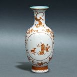 A CHINESE IRON-RED 'BUDDHIST EMBLEMS' VASE WITH GOLD PAINTING