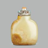 A CHINESE FINELY CARVED YELLOW JADE 'LIUHAI AND TOAD' SNUFF BOTTLE