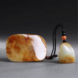 QING DYNASTY (1644-1911) A WHITE AND RUSSET JADE BELT BUCKLE AND A WHITE JADE SEAL The seal face