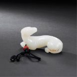 SONG DYNASTY (960-1279) A WHITE JADE RECUMBENT DOG PENDANT L 6.6 cm. (2 5/8 in.) 宋 白玉回首臥犬