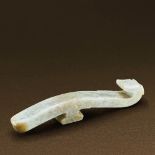 WARRING STATES PERIOD (475-221 BC) AN UNEARTHED WHITE JADE DRAGON BELT HOOK L 11.1 cm. (4 3/8 in.) H
