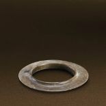 SHANG DYNASTY (CIRCA 1600-1100 BC) A SANXINGDUI JADE HUANG D 8.3 cm. (3 1/4 in.) 商 三星堆玉凸唇環