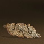 WARRING STATES PERIOD (475-221 BC) A WHITE JADE DRAGON-SHAPED PENDANT L 9.9 cm. (3 7/8 in.) T 0.4