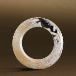 WARRING STATES PERIOD (475-221 BC) AN UNEARTHED WHITE JADE DISC, YUAN D 4.4 cm. (1 3/4 in.) T 0.2