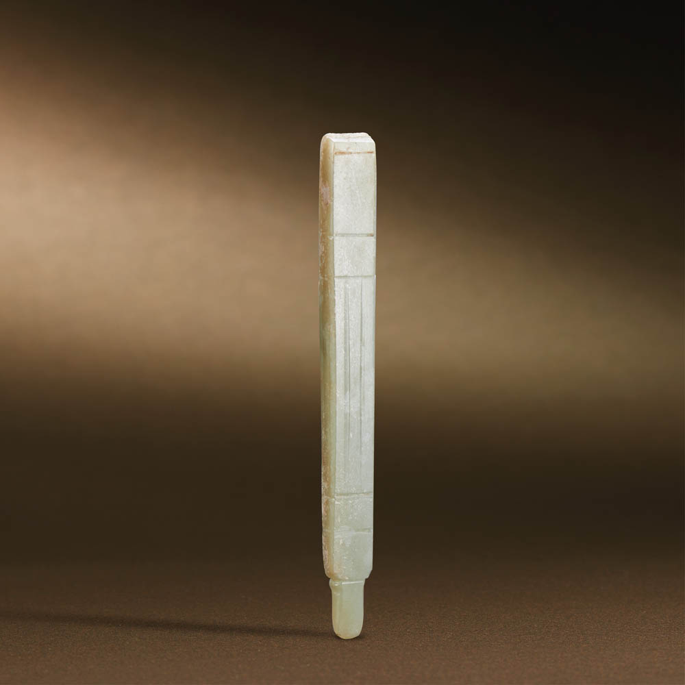 WESTERN ZHOU (CIRCA 1100-771 BC) A WHITE JADE HANDLE-SHAPED FITTING L 12.9 cm. (5 in.) 西周 白玉柄形器