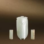 HAN DYNASTY (206 BC-AD 220) A JADE CICADA AND TWO WHITE JADE FUNERAL PLUGS The largest：L 5.9 cm. (