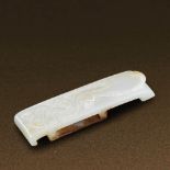 HAN DYNASTY (206 BC-AD 220) AN UNEARTHED WHITE JADE 'DRAGON AND PHOENIX' SWORD SLIDE L 10.1 cm. (4