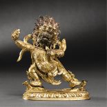 TIBETO-CHINESE, QING DYNASTY (1644-1911) A GILT-BRONZE FIGURE OF BEGTSE H 12.8 cm. (5 in. )