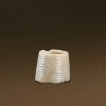 SHANG DYNASTY (CIRCA 1600-1100 BC) A WHITE JADE ARCHAISTIC CYLINDER H 3.1 cm. (1 1/4 in.) 商 白玉弦紋箍形器