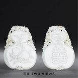 QING DYNASTY (1644-1911) A WHITE JADE DOUBLE-GOURD PLAQUE L 7.5 cm. (3 in.) T 0.6 cm. 清 白玉葫蘆形囍字牌