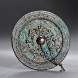 SIX DYNASTIES (265-589) A BRONZE 'DEITIES AND BEAST' MIRROR D 12.7 cm. (5 in.) Reference: See a