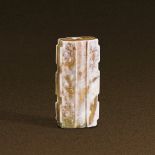 WARRING STATES PERIOD (475-221 BC) A WHITE JADE SAWTOOTH-SHAPED TUBE, LEZI L 3.9 cm. (1 1/2 in.)