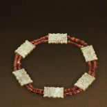 WESTERN ZHOU (CIRCA 1100-771 BC) A GROUP OF YELLOW JADE PLAQUES AND AGATE BEADS NECKLACE Plaque: L