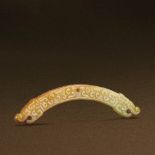 SPRING AND AUTUMN PERIOD (770-476 BC) A YELLOW JADE DOUBLE-DRAGON HENG L 9 cm. (3 1/2 in.) T 0.8 cm.