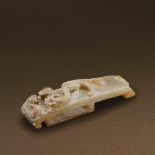 HAN DYNASTY (206 BC-AD 220) AN UNEARTHED WHITE JADE SWORD SLIDE L 9.2 cm. (3 5/8 in.) 漢 生坑白玉雙螭紋劍璲