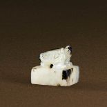 HAN DYNASTY (206 BC-AD 220) A WHITE AND RUSSET JADE 'TURTLE' SEAL The seal face left uncarved. H 2