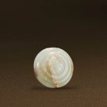 WARRING STATES PERIOD (475-221 BC) A WHITE JADE ARCHAIC SWORD HILT POMMEL D 3.4 cm. (1 1/4 in.) 戰國