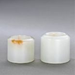 QING DYNASTY (1644-1911) TWO WHITE JADE ARCHER'S RINGS, BANZHI The largest: D 3.1 cm. (1 1/4 in.)