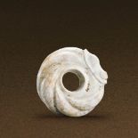 SHANG DYNASTY (CIRCA 1600-1100 BC) A JADE CARVED CIRCULAR DRAGON PENDANT D 3.6 cm. (1 3/8 in.) T 1