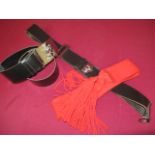 Selection of Modern Drum & Pipe Band Belts consisting black leather wide waist belt with rectangular