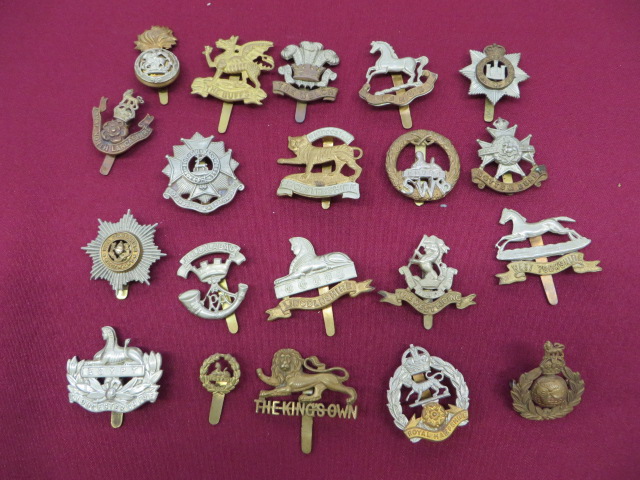 Good Selection of Infantry Cap Badges including brass The Buffs ... Brass Kings Own ... Bi-metal