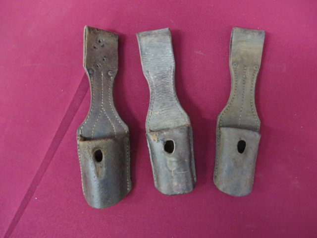 Three WW1/WW2 German Bayonet Frogs brown leather examples.  One with maker stamp dated “1913”.  Some