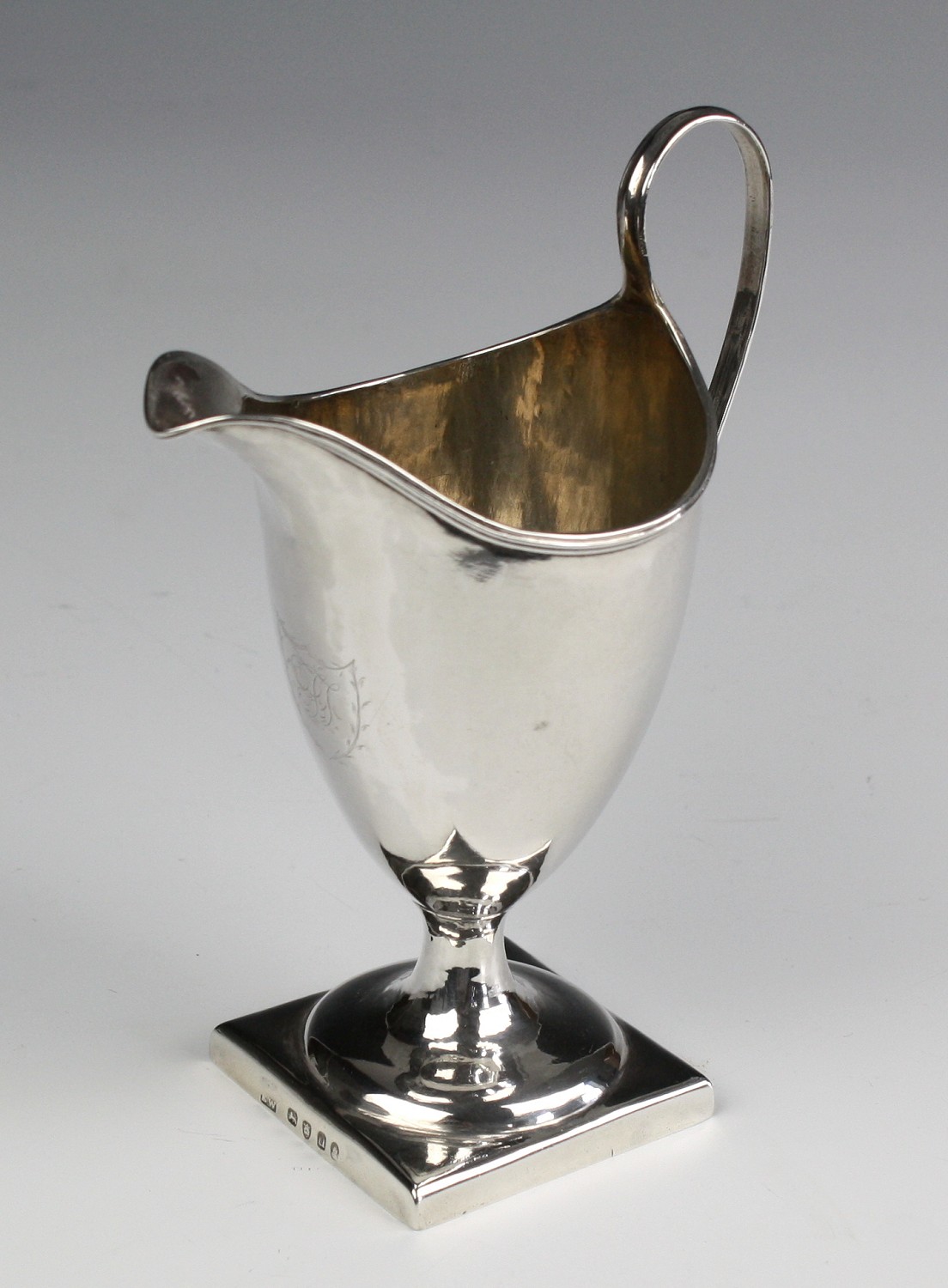 A William IV silver cream jug Eden Wintle, London 1835, helmet form with steep reeded handle, on - Image 2 of 7