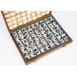 A cased set of 72 antique prosthetic eyes. an amazing collection of 72 FALSE glass eyes, various