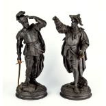 A pair of Victorian spelter figures modelled as Conquistadors, each brandishing a brass sword, 19in.