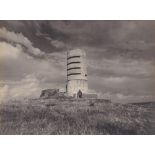 A Guernsey interest photograph 1950s, depicting two figures at the top of Fort Saumarez