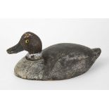 A carved and painted wooden duck decoy 19th century, probably American, dark grey body with white