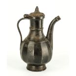 An unusual cast iron Russian coffee pot 19th century, ovoid body with thick vertical facets,