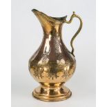 A 19th century Mamluk tinned brass and copper pitcher ovoid body engraved with stylised knot