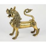 A polished brass Chinese temple lion 20th century, square stance with mouth open wide, 8½in. (21.