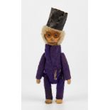 A very rare novelty Schuco perfume monkey circa 1930, dressed in purple felt with top hat, bottle/