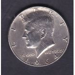 1964 USA silver half dollar, it has been used as a piece of jewellry.